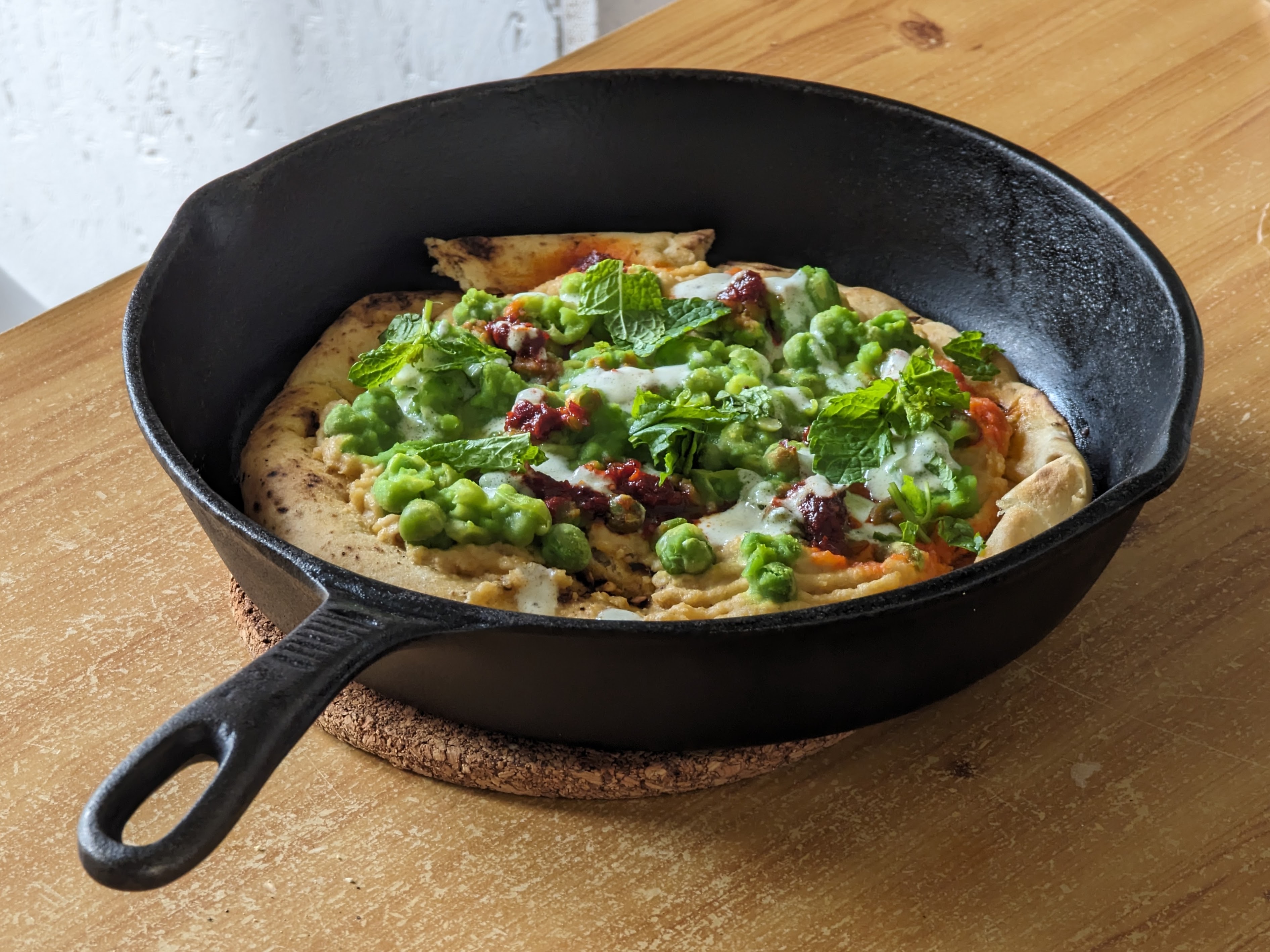 Flatbread with hummus, crushed peas and 'nduja